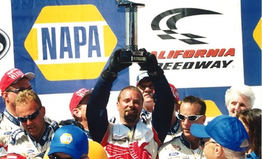 Jeffery Baker celebrates a win at California Speedway in the early 2000s