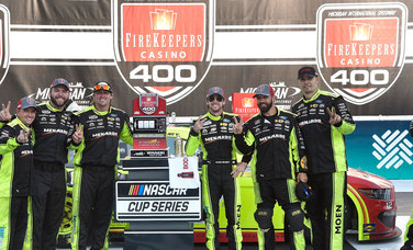 Chris Conklin (far right) in Victory Lane at Michigan this season with the No. 12 Menards Ford team