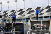 Paul Wolfe and Todd Gordon watch from atop the transporters